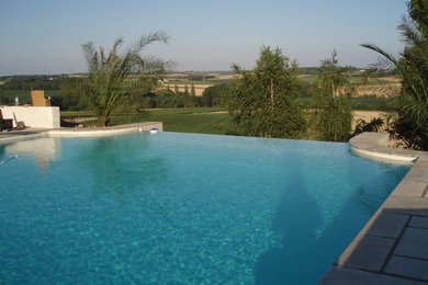 Photo of a mediterranean swimming pool in Wiltshire.