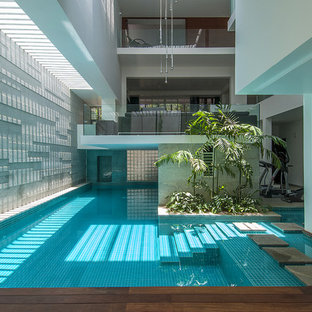 Photo of a large contemporary indoor custom-shaped pool in Bengaluru.