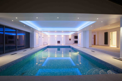 Medium sized contemporary indoor rectangular lengths swimming pool in Wiltshire.