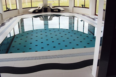 This is an example of a contemporary swimming pool in Cheshire.
