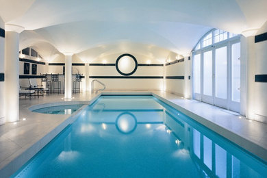 Example of a minimalist indoor pool design in Surrey