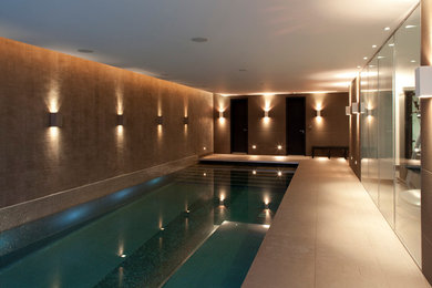 Design ideas for a large contemporary indoor swimming pool in London.
