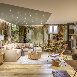 Inspiration pour un grand sous-sol ethnique enterré avec un mur multicolore, un sol en carrelage de porcelaine, un poêle à bois, un manteau de cheminée en métal, un plafond décaissé et du papier peint.