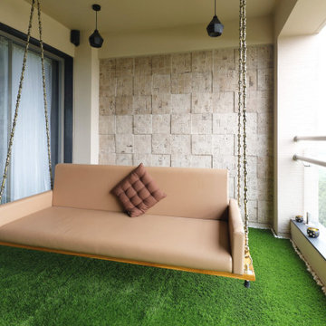 Balcony with Swing Bed, Egyptian wall cladding, grass floor.
