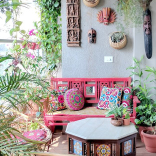 Foto di un balcone eclettico con un giardino in vaso