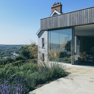 Medium sized coastal side terrace in Other with no cover.