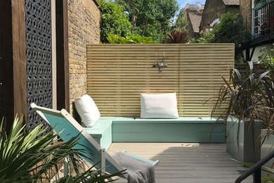This is an example of a medium sized contemporary side terrace in London with no cover.