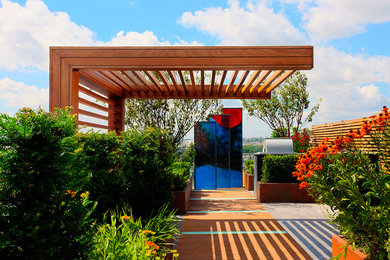 Example of a trendy deck design in Surrey