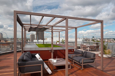 Inspiration for a contemporary roof rooftop terrace in London with a pergola and an outdoor kitchen.