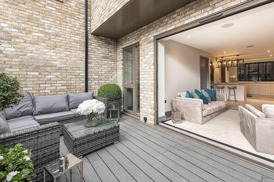 Small contemporary side terrace in London with no cover.