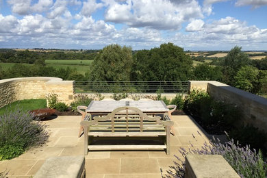Large rural back terrace in Oxfordshire with no cover.