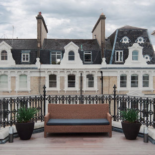 Design ideas for a medium sized contemporary roof rooftop terrace in London with a potted garden and no cover.