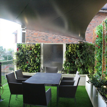 Roof Terrace Sevenoaks - Artificial grass, shade sail, green walls and lighting