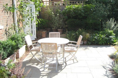 Photo of a small rural back patio in Buckinghamshire with no cover.