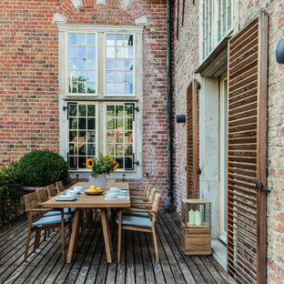 Idee per una terrazza minimal di medie dimensioni con un giardino in vaso e nessuna copertura