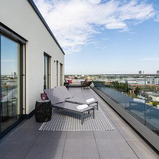 Immagine di una terrazza minimal sul tetto, di medie dimensioni e sul tetto con nessuna copertura