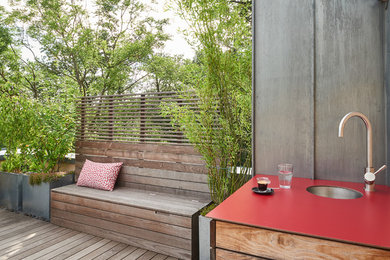 This is an example of a medium sized contemporary roof terrace in Other with a water feature.