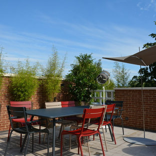 Cette photo montre une terrasse sur le toit tendance.