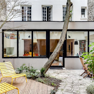 Idee per un patio o portico contemporaneo di medie dimensioni e in cortile con pedane e nessuna copertura