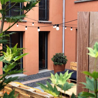 Immagine di un piccolo patio o portico industriale in cortile