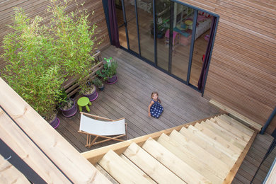 Ejemplo de terraza actual con jardín de macetas