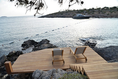 Coastal terrace with a dock and no cover.