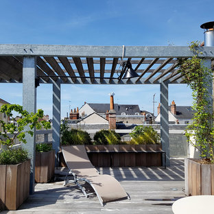 Cette image montre une terrasse sur le toit urbaine avec une pergola.