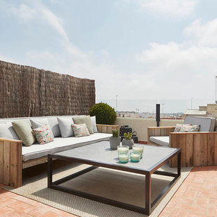 Ejemplo de terraza mediterránea, sin cubierta, en azotea