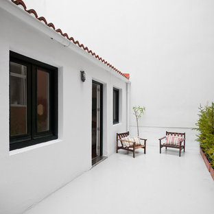 Diseño de terraza mediterránea, sin cubierta, en azotea, con jardín de macetas