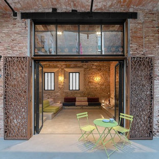 Esempio di un grande portico industriale dietro casa
