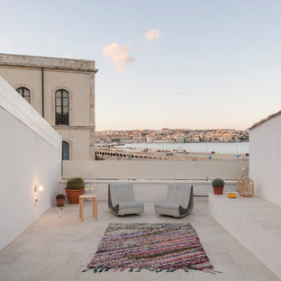 Ispirazione per una terrazza mediterranea sul tetto e sul tetto con nessuna copertura