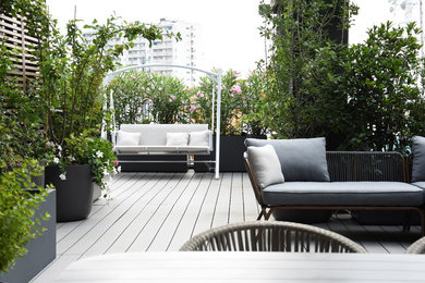 Imagen de terraza tradicional renovada sin cubierta en azotea con jardín de macetas