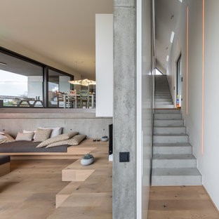 Inspiration för mycket stora moderna raka betongtrappor, med sättsteg i betong