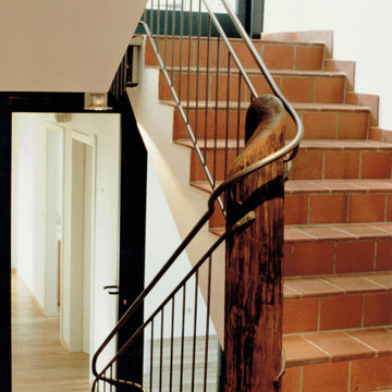 Treppengeländer in einem umgebauten Vierkanthof