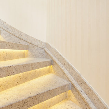 Treppenrenovierung mit Naturstein und LED Beleuchtung über eine Holztreppe