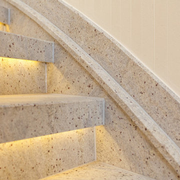 Treppenrenovierung mit Naturstein und LED Beleuchtung über eine Holztreppe