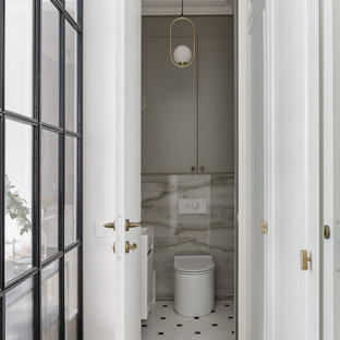 Foto di un bagno di servizio nordico di medie dimensioni con ante lisce, ante grigie, WC sospeso, piastrelle grigie, piastrelle in gres porcellanato, pareti grigie, pavimento con piastrelle in ceramica, lavabo a consolle, top in superficie solida, pavimento bianco, top bianco e mobile bagno sospeso