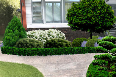 Стильный дизайн: солнечный, летний участок и сад на переднем дворе в классическом стиле с хорошей освещенностью и покрытием из каменной брусчатки - последний тренд