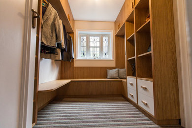 This is an example of a contemporary utility room in Other with medium wood cabinets.