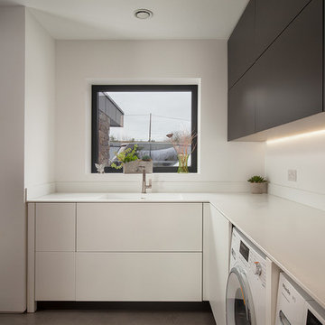 Contemporary utility room: matte grey, white