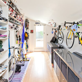 Inspiration for a contemporary utility room in Other with open cabinets.