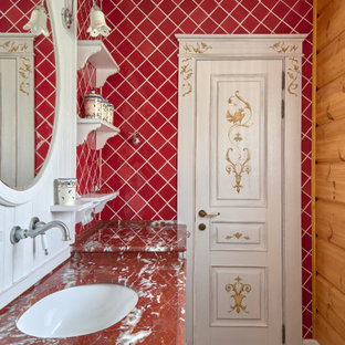 Photo of a country bathroom in Moscow with red tile, brown walls, medium hardwood floors, an undermount sink, brown floor and red benchtops.