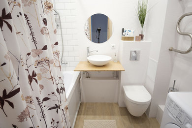 Small scandi ensuite bathroom in Saint Petersburg with a submerged bath, a wall mounted toilet, white tiles, white walls, porcelain flooring, a built-in sink, laminate worktops, beige floors, an open shower, beige worktops and metro tiles.