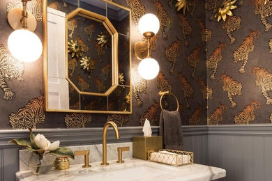 На фото: ванная комната в современном стиле с фасадами с утопленной филенкой, фиолетовыми фасадами, врезной раковиной, белой столешницей и коричневыми стенами с