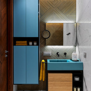 Photo of a contemporary bathroom in Moscow with turquoise cabinets, an integrated sink, grey floor, a single vanity and a freestanding vanity.