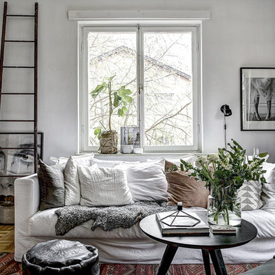Living room - mid-sized scandinavian formal and open concept light wood floor living room idea in Stockholm with white walls