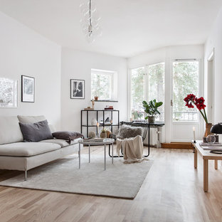 Inspiration för mellanstora nordiska separata vardagsrum, med vita väggar, ljust trägolv, beiget golv och ett finrum
