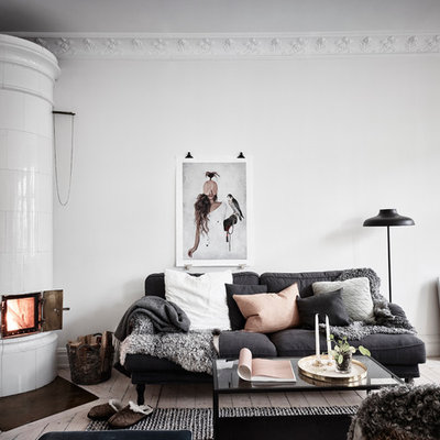 Living room - mid-sized scandinavian formal and open concept light wood floor living room idea in Gothenburg with white walls and no tv