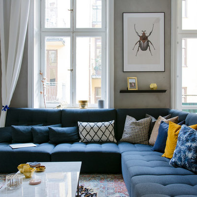 Living room - mid-sized scandinavian open concept light wood floor living room idea in Stockholm with gray walls, no fireplace and no tv