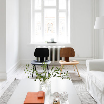 Living room - mid-sized scandinavian formal and enclosed painted wood floor living room idea in Malmo with white walls, no fireplace and no tv
